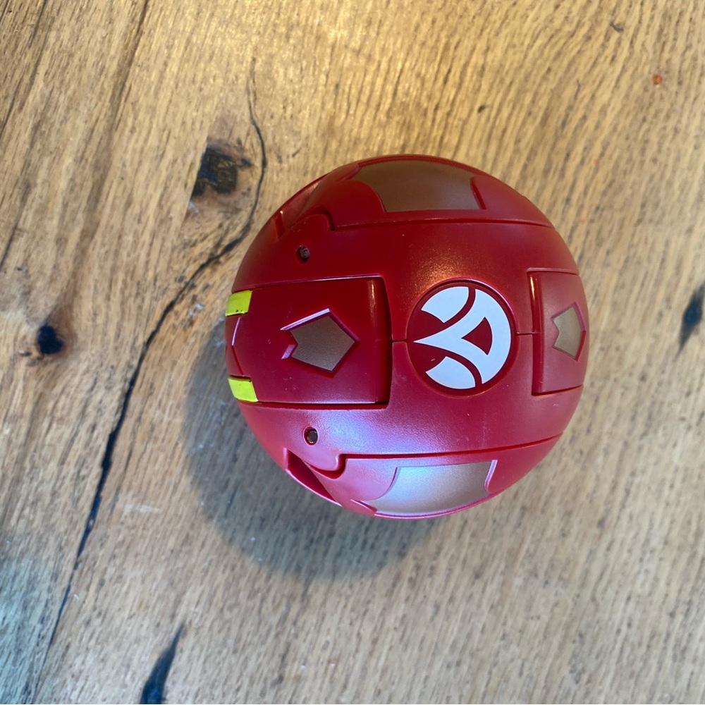 Red and Gold Action Ball by [Brand]‎
